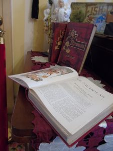 St. Nicholas Books on display in the parlor contain stories from the popular monthly children's magazine from the late 1880s by Scribner's.